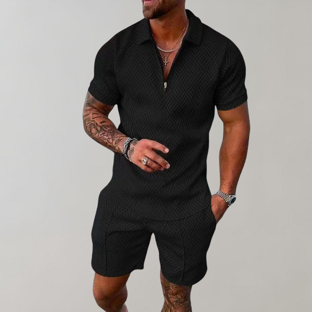 Zwart heren zomerset, korte mouwen en broek, met subtiel patroon. Perfect voor casual zomeroutfits. Comfortabele en stijlvolle herenkleding.